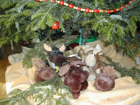 plush moose herd under the tree